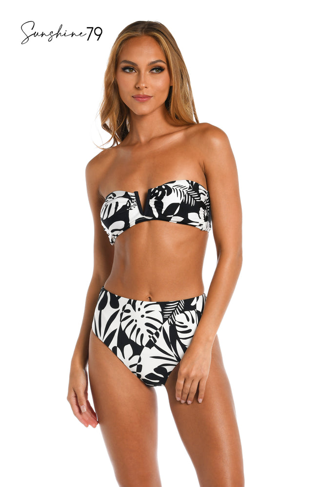 Model is wearing a black and white multi colored tropical printed bandeau top from our Optic Tropic collection!