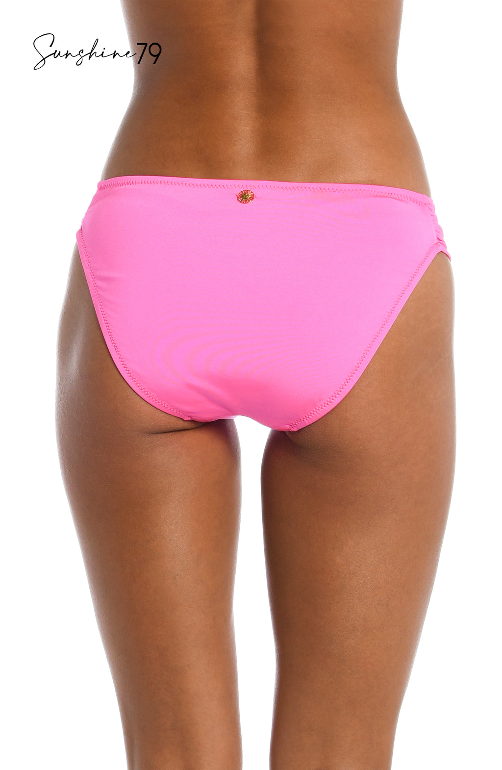 Model is wearing a solid hot pink side shirred bikini bottom from our Sunshine 79 brand.