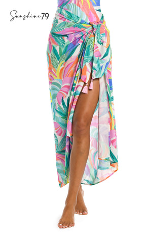 
            
                Load image into Gallery viewer, Model is wearing a multi colored tropical printed pareo cover up wrap from our Sunshine 79 brand.
            
        