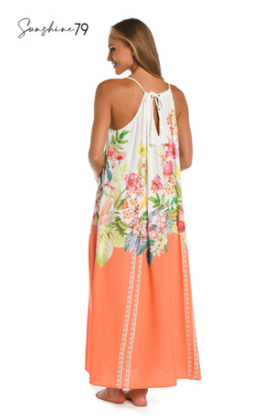Model is wearing a coral multicolored floral printed halter maxi dress cover up from our Sunshine 79 brand.