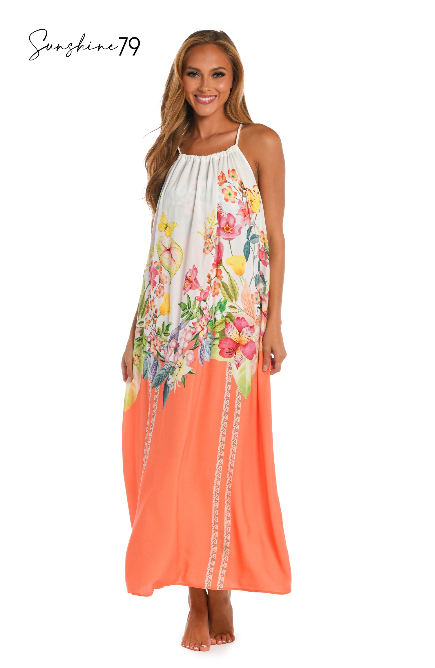 Model is wearing a coral multicolored floral printed halter maxi dress cover up from our Sunshine 79 brand.