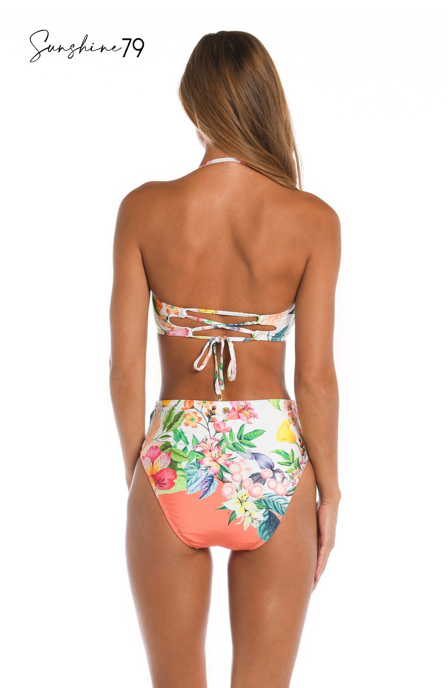 Model is wearing a coral multicolored floral printed bandeau bikini top from our Sunshine 79 brand.