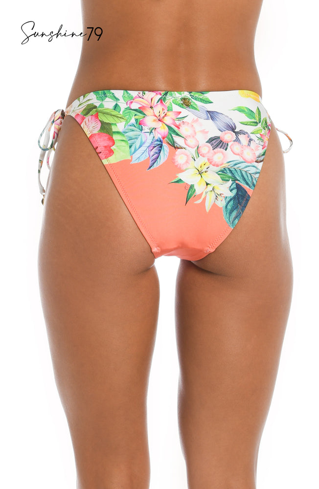 Model is wearing a coral multicolored floral printed string tie side hipster bikini bottom from our Sunshine 79 brand.
