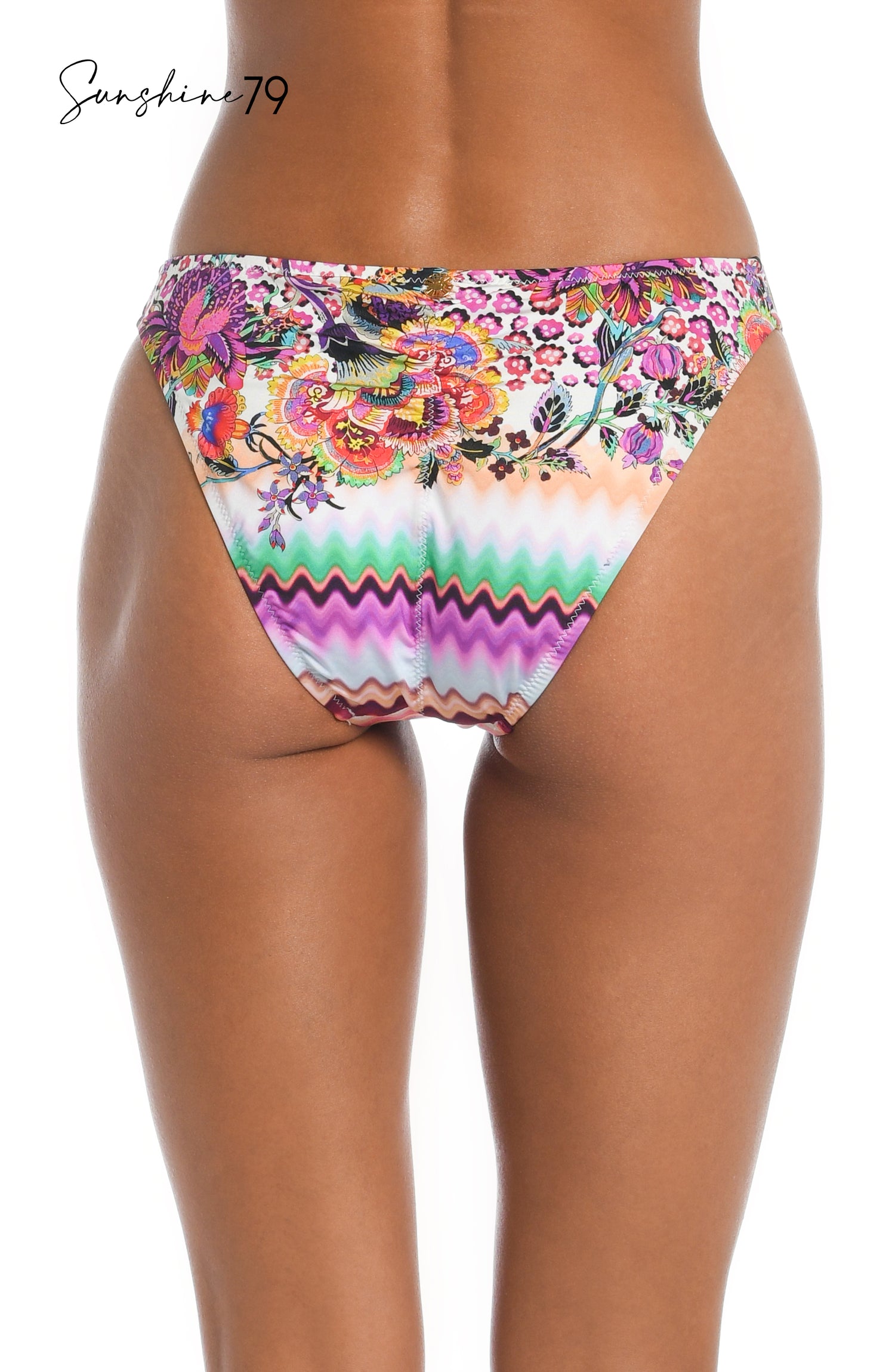 Model is wearing a pink multicolored floral and striped printed french cut bikini bottom from our Sunshine 79 brand.