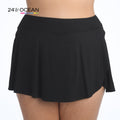 Model is wearing a solid black colored petal skort swim bottom from our 24th & Ocean brand.