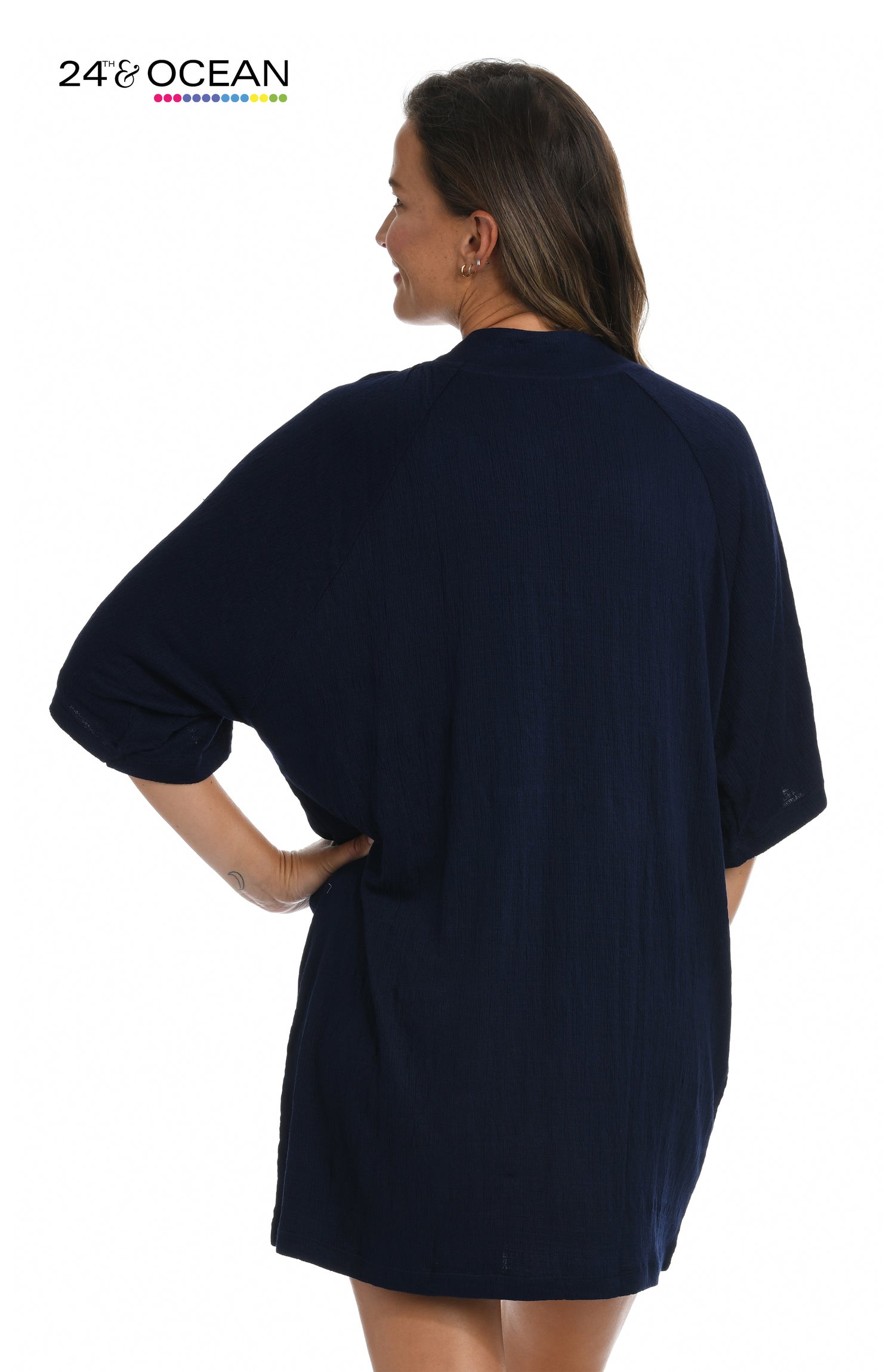Model is wearing a solid midnight blue colored lace front tunic cover up from our 24th & Ocean brand.