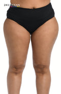 Model is wearing a solid black colored high waist bikini bottom from our 24th & Ocean brand.