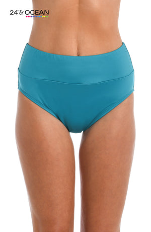 
            
                Load image into Gallery viewer, Model is wearing a solid teal colored high waist bikini bottom from our 24th &amp;amp; Ocean brand.
            
        