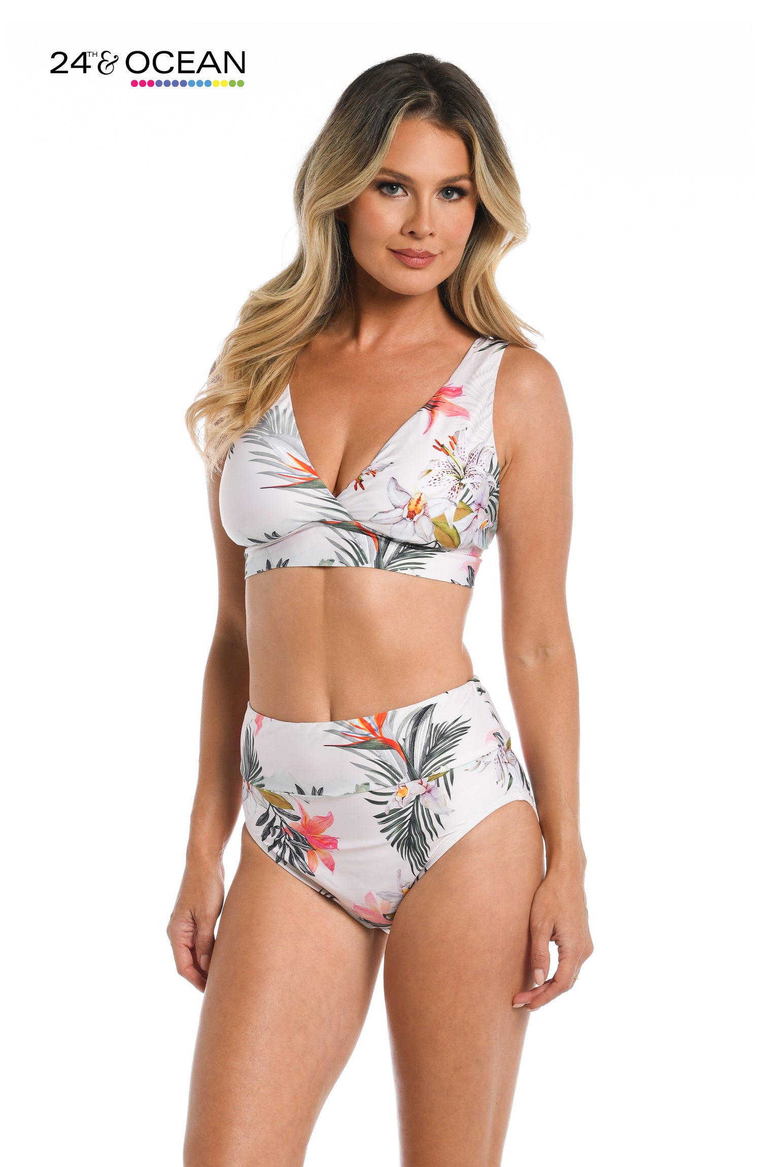 Model is wearing a white multi colored tropical printed over the shoulder top from our Tahiti Skies collection!