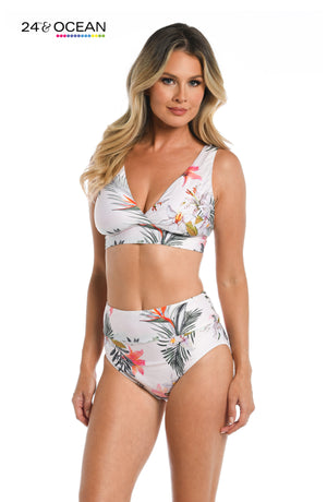 
            
                Load image into Gallery viewer, Model is wearing a white multi colored tropical printed over the shoulder top from our Tahiti Skies collection!
            
        