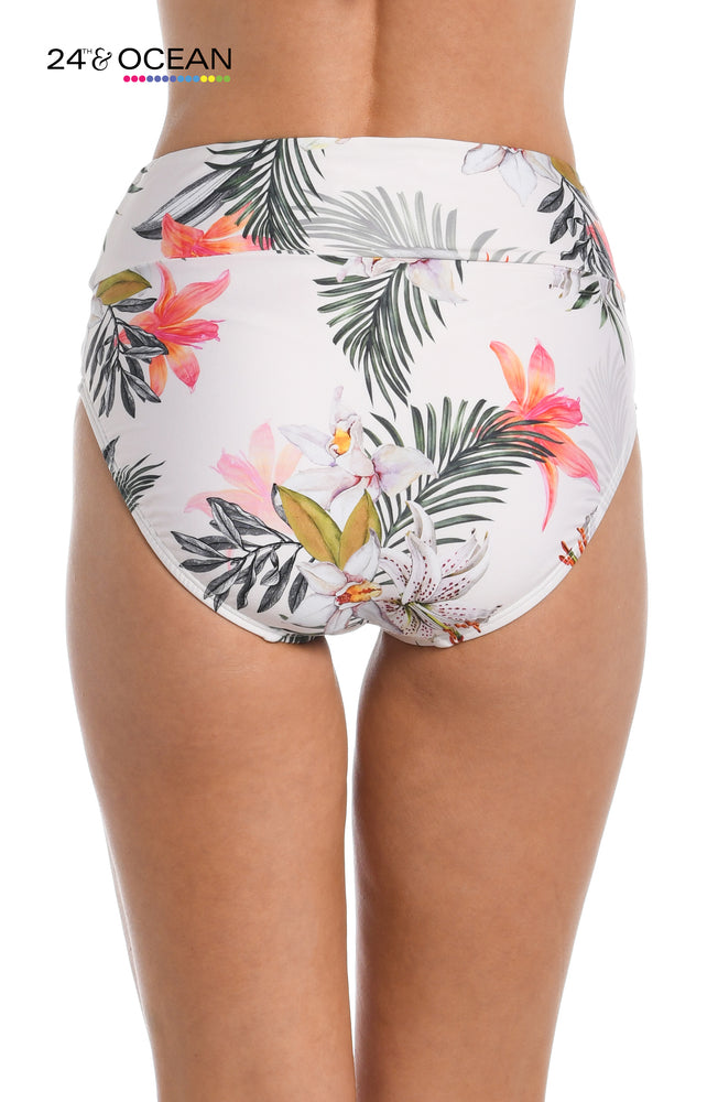 Model is wearing a white multi colored tropical printed high waist bottom from our Tahiti Skies collection!