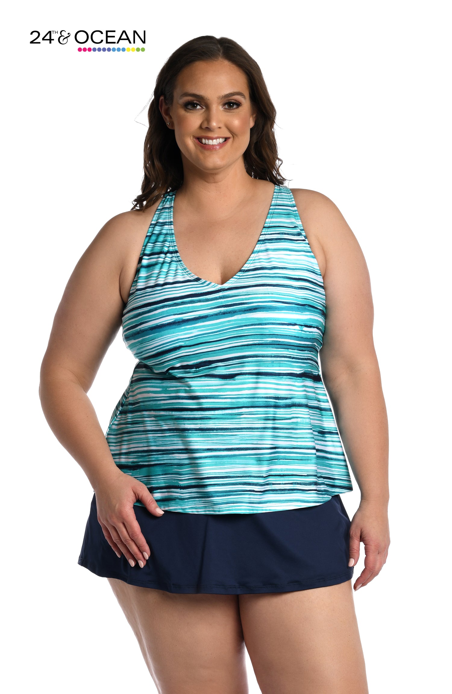 Model is wearing a teal multi colored striped printed over the shoulder tankini top from our Seaside Breeze collection!