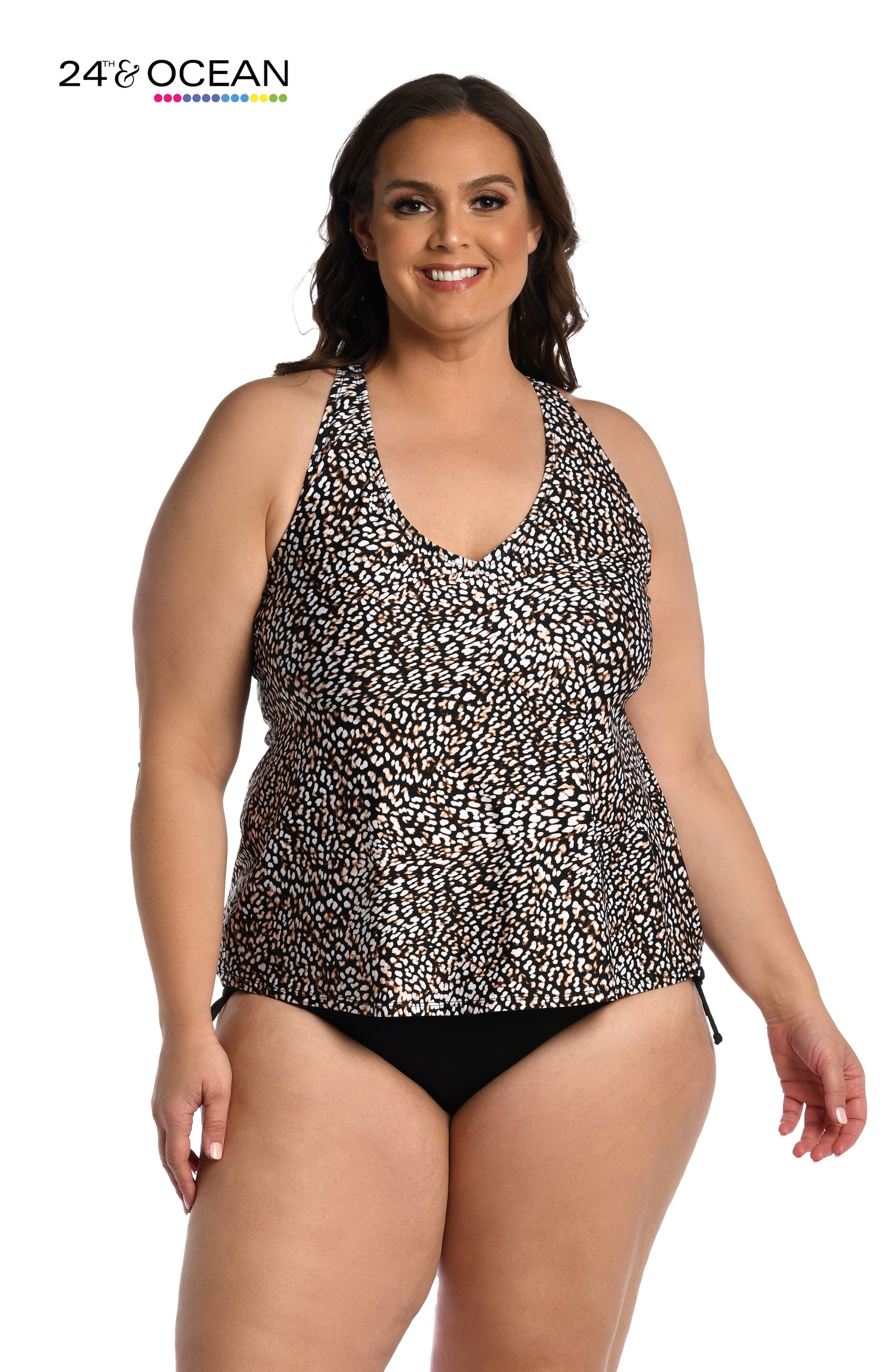 Model is wearing a black multi colored dotted over the shoulder tankini top from our Wild Instincts collection!