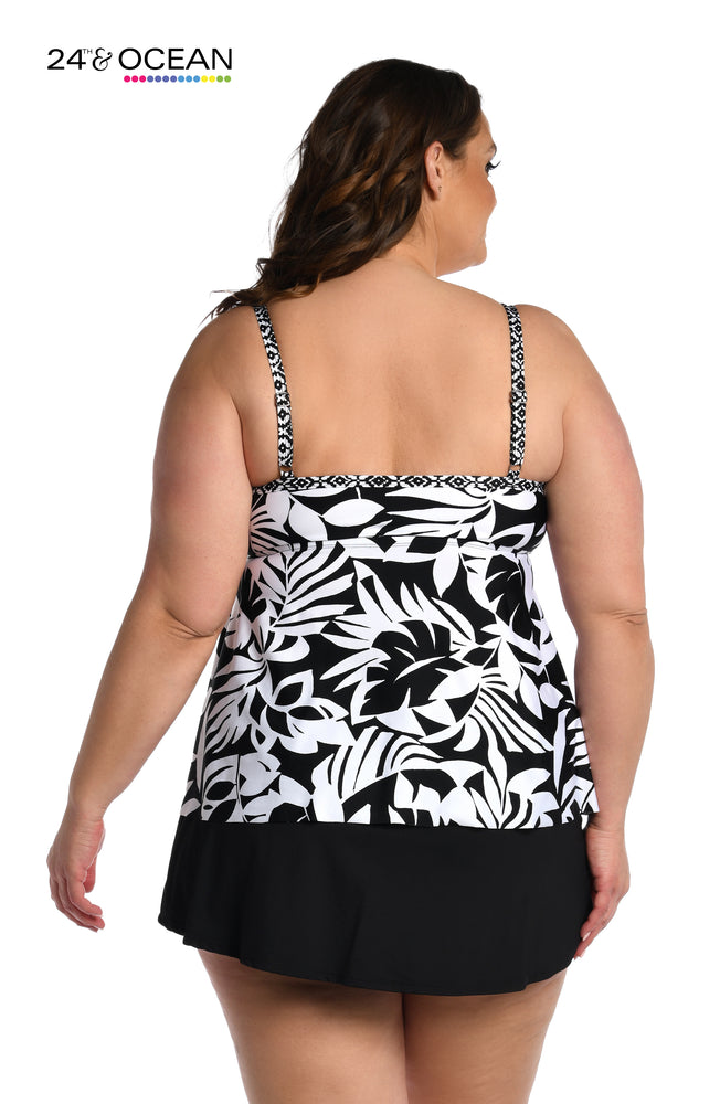 Model is wearing black and white multi colored tropical printed tankini top from our Antigua Leaf collection!