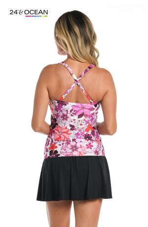 Model is wearing a pink multi colored tropical printed over the shoulder tankini top from our Tropic Blooms collection!