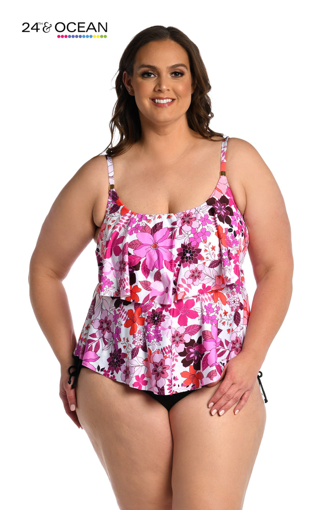 
            
                Load image into Gallery viewer, Model is wearing a pink multi colored tropical tiered tankini top from our Tropic Blooms collection!
            
        