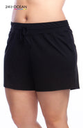 Model is wearing a solid black colored swim short bottom from our 24th & Ocean brand.