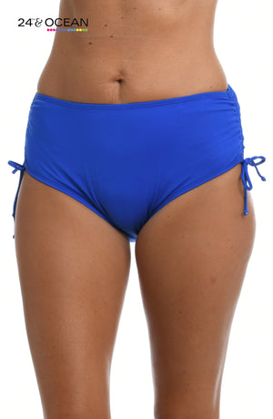 
            
                Load image into Gallery viewer, Model is wearing a solid sapphire blue colored mid waist adjustable hipster bikini bottom from our 24th &amp;amp; Ocean brand.
            
        