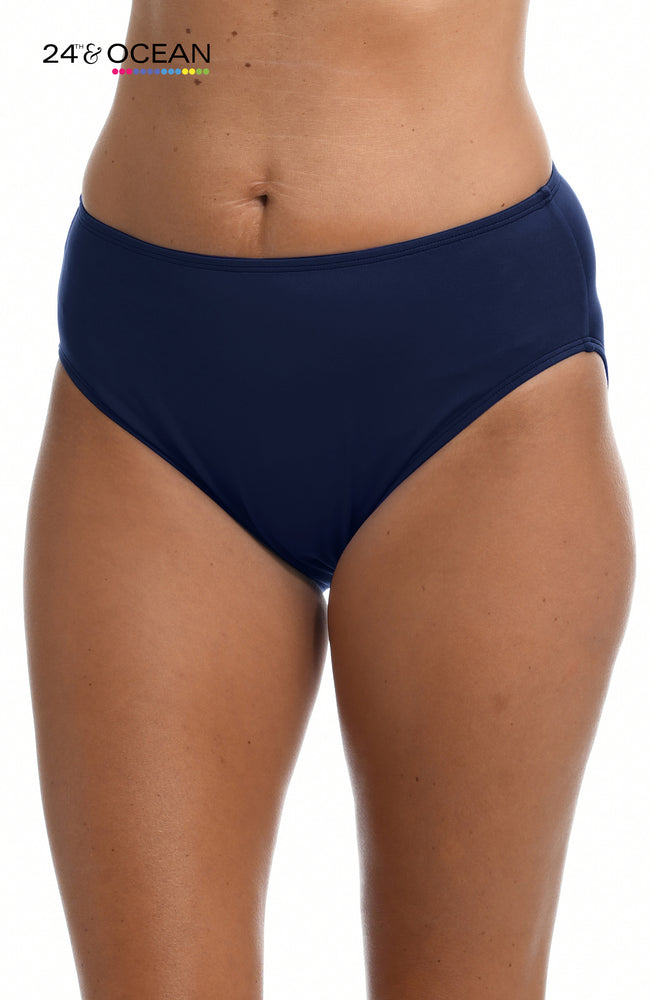 
            
                Load image into Gallery viewer, Model is wearing a solid midnight blue colored mid waist hipster bikini bottom from our 24th &amp;amp; Ocean brand.
            
        